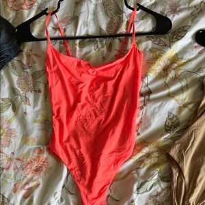 Bright pink bodysuit